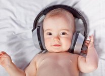 cute-baby-listens-music-through-headphones-close-up_170896-636.jpg