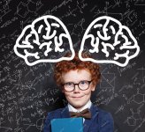 young-boy-genius-brain-power-happy-redhead-kid-against-chalkboard_263368-8462.jpg